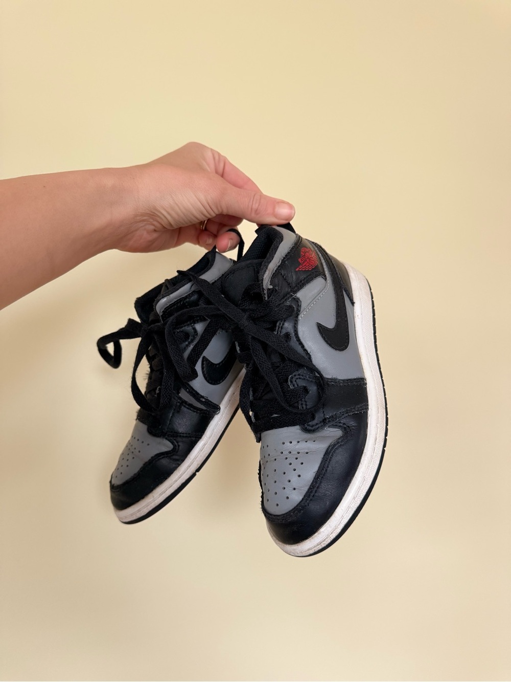 Nike Air Jordan 1 Kids Black & Gray Low-Top Sneakers with Red Accent